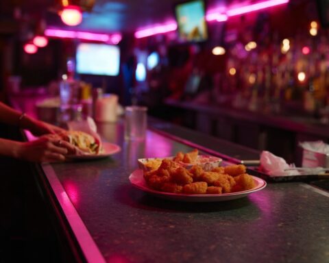 tater tots on plate in divebar - Best Dive Bar Dinners in Pueblo