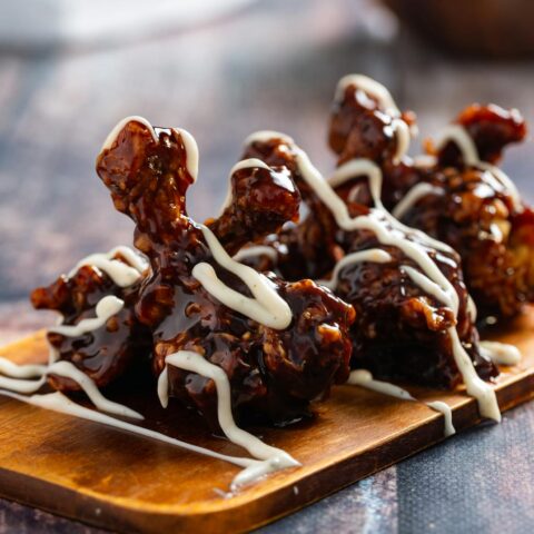 best wings in denver featured image of honey bbq wings drizzled with ranch