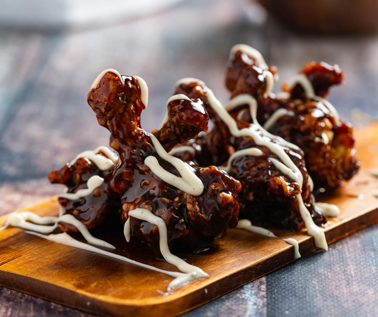 best wings in denver featured image of honey bbq wings drizzled with ranch
